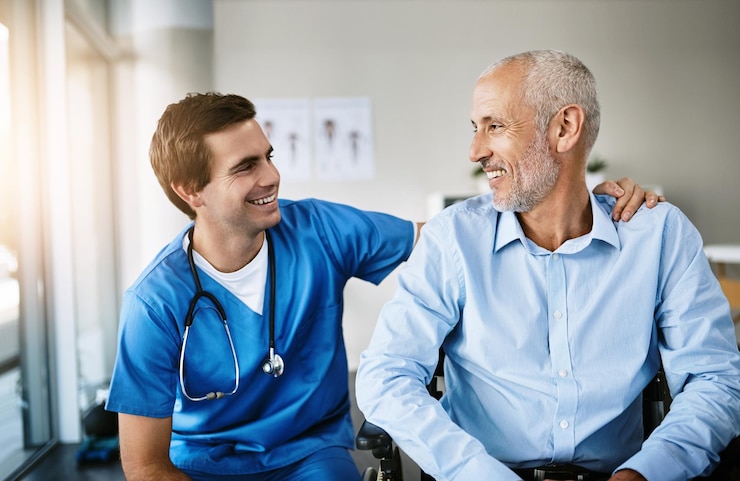 Photo senior man and nurse with patient in clinic care and together for wellness consultation with medical employee support healthcare and wheelchair for person with a disability hospital and trust