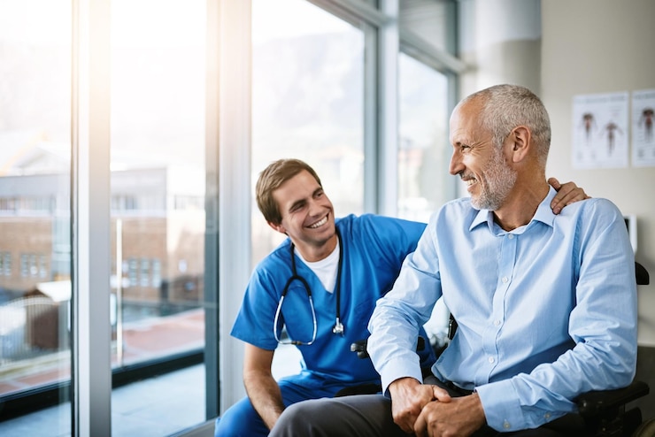 Photo senior man and nurse with patient in office care and together for wellness consultation with medical employee support healthcare and medicine help with smiling or happy people clinic and trust