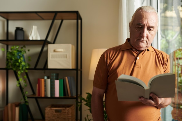 Senior Man Reading Captivating Book