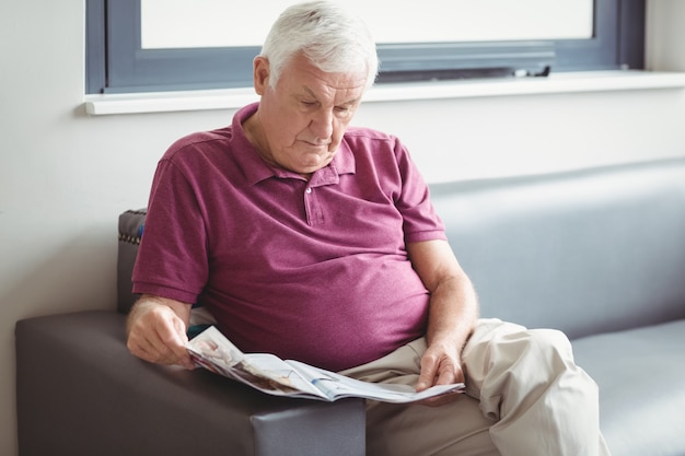 Senior man reading the newspaper