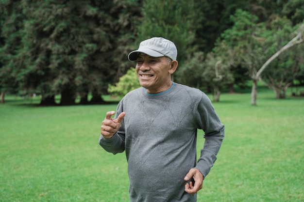 Senior man running in the garden