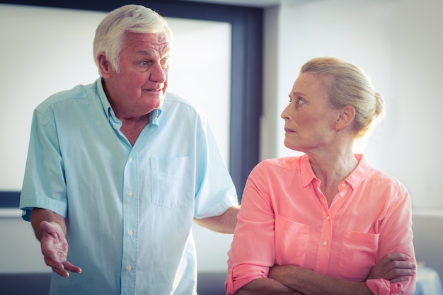 Senior man shouting on senior woman