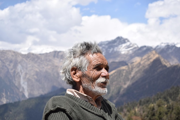 senior man standing against mountain