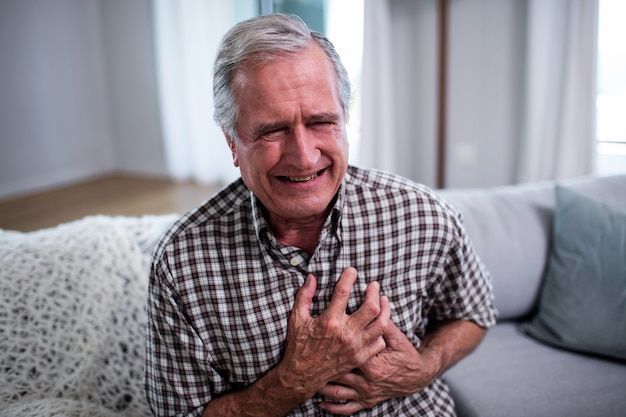 Senior man suffering from heart attack