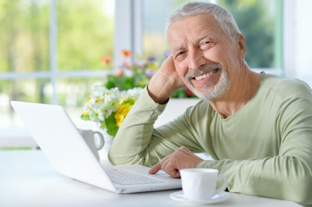 Senior man using laptop