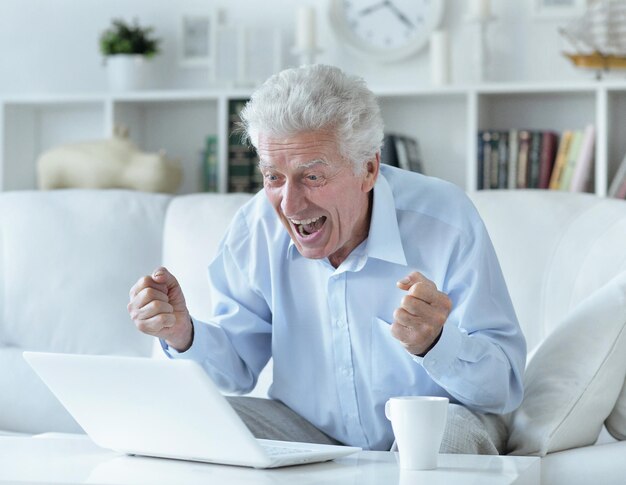 Senior man using laptop