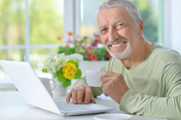 Senior man using laptop