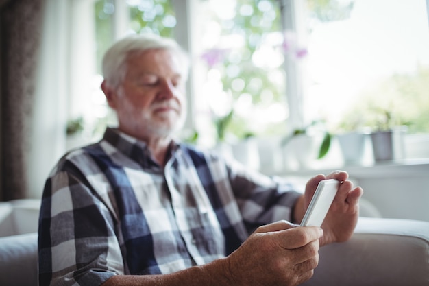 Senior man using mobile phone