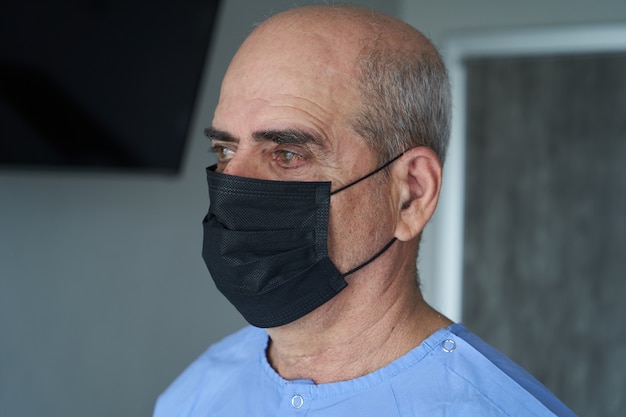 Senior man wearing face mask during coronavirus and flu outbreak