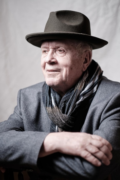 senior man wearing hat looking away
