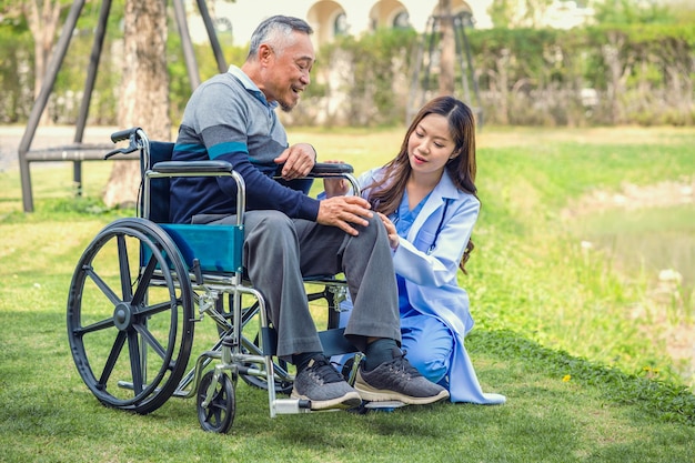 Senior man on wheelchair with doctor