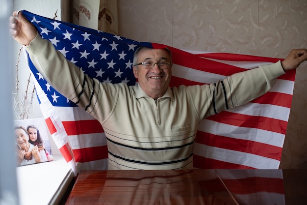 Senior man with american flag.