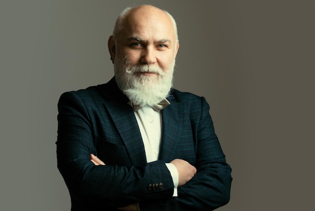 Senior man with arms crossed elderly old mature man close up portrait