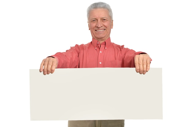 Senior man with blank advertising board or copy space, isolated on white