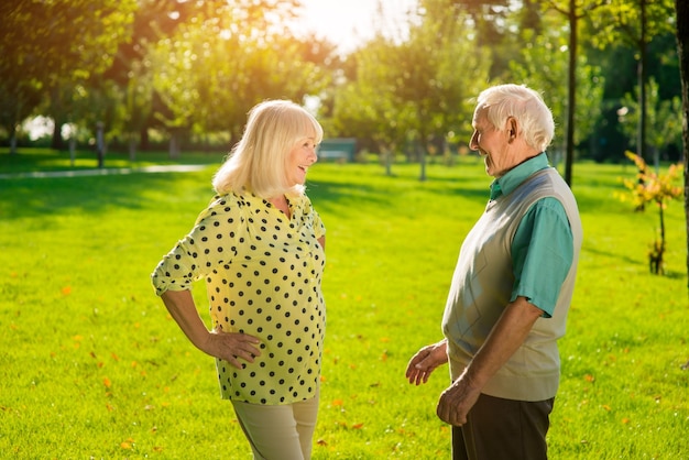 Senior man and woman outdoors.