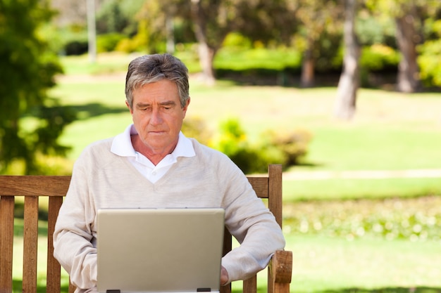 Senior man working on his laptop