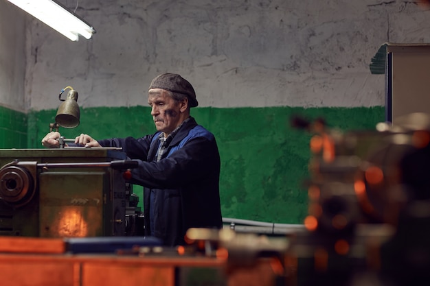 Senior man working in the plant