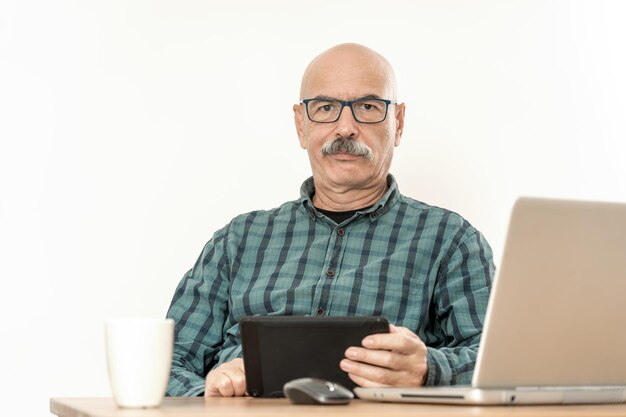 Senior Man Working with Laptop at Home