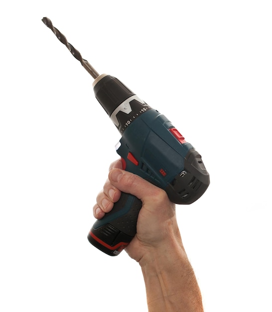 Senior mans arm holding a power drill