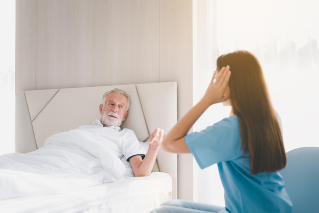 Senior men talking with caregiver in room Nursing care home concept