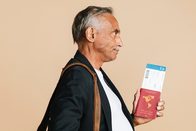 Senior mixed indian man boarding the plane