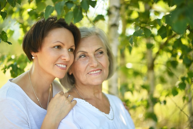 Senior Mother and her nice daughter in  park