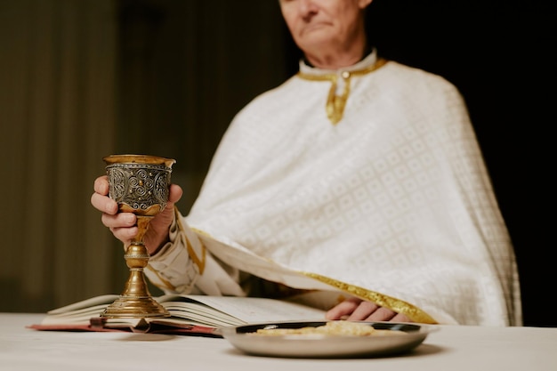 senior pastor starting holy communion rite