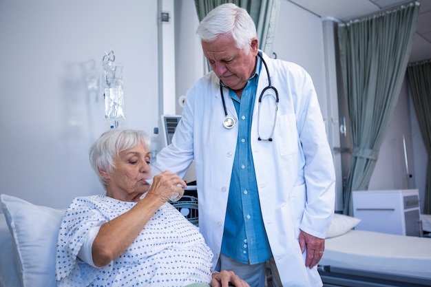 Senior patient drinking a glass of water