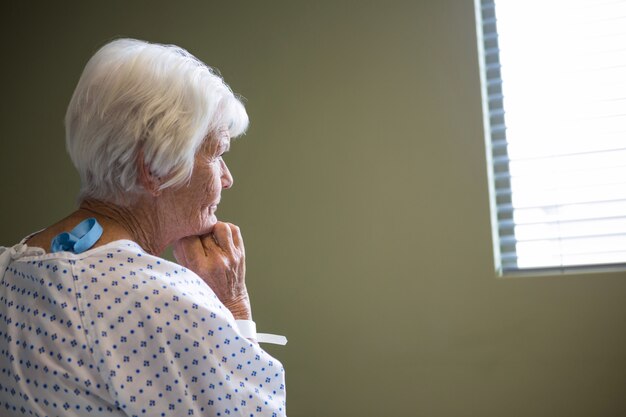 Senior patient standing at hospital