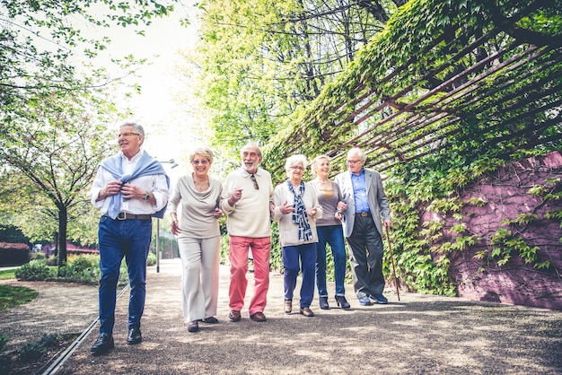 Senior people walking outdoors