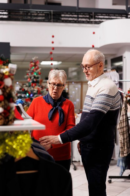 Senior persons browsing for jackets