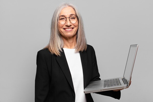 Senior pretty businesswoman with a laptop