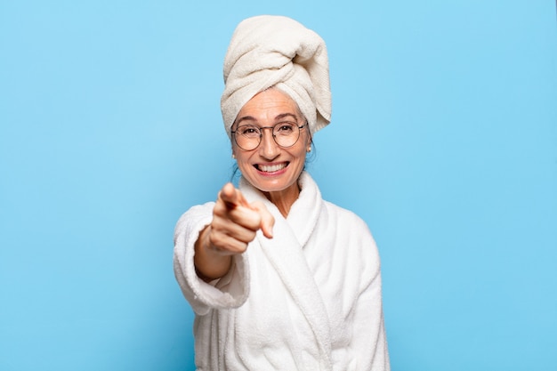 Senior pretty woman after shower wearing bathrobe