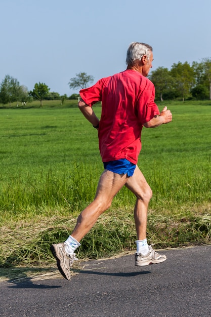 Senior runner while training for a competition