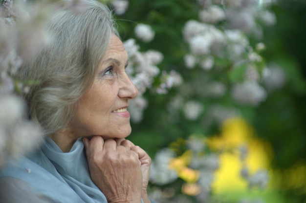 Senior smiling woman in park