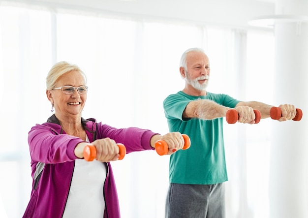 Senior stretching exercise and doing yoga at home