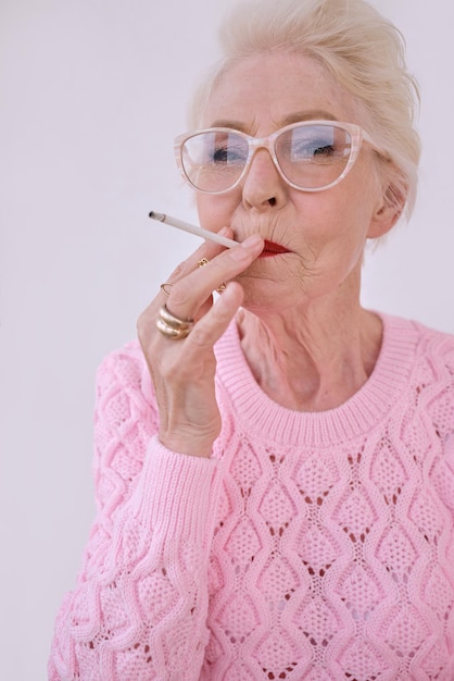 senior stylish woman smoking cigarette