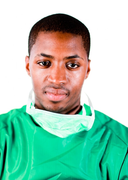 Senior surgeon in green scrubs