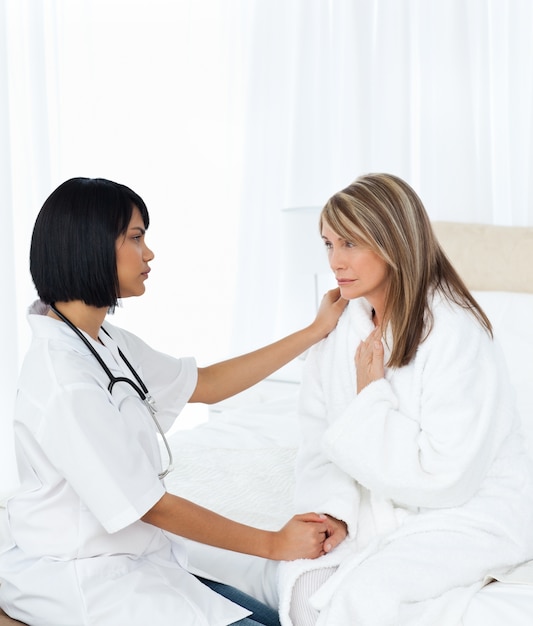 Senior talking with her nurse