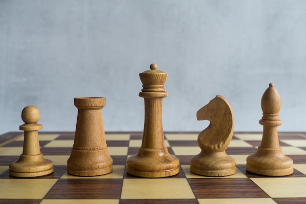 Senior white chess figures on the board