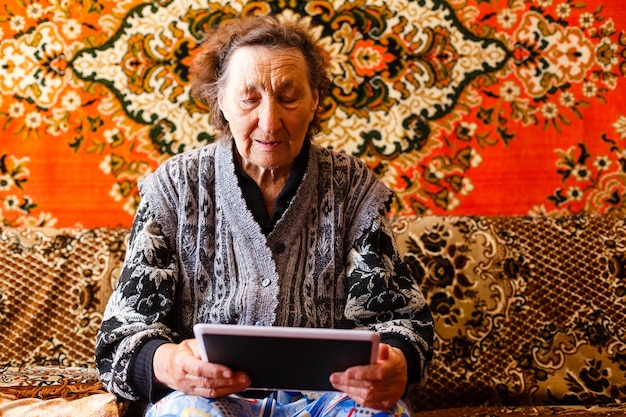 Senior woman browsing on digital tablet