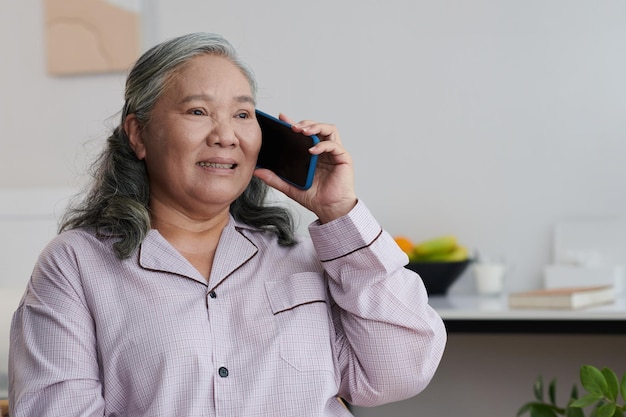Senior Woman Calling Family Members