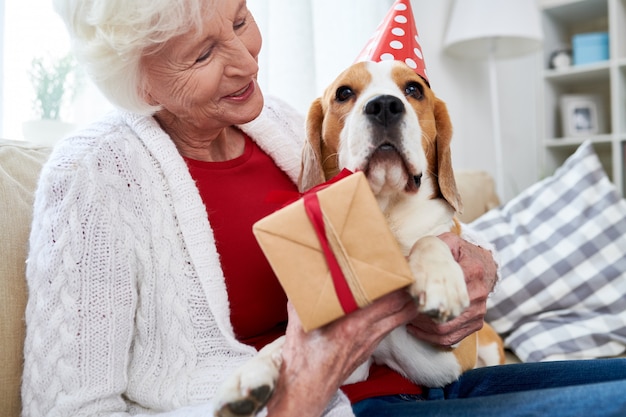 Senior woman celebrating her dogs birthday