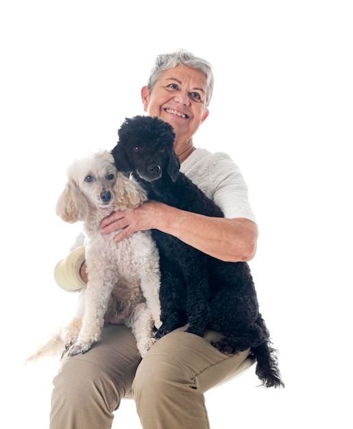 senior woman and dogs in front of white background