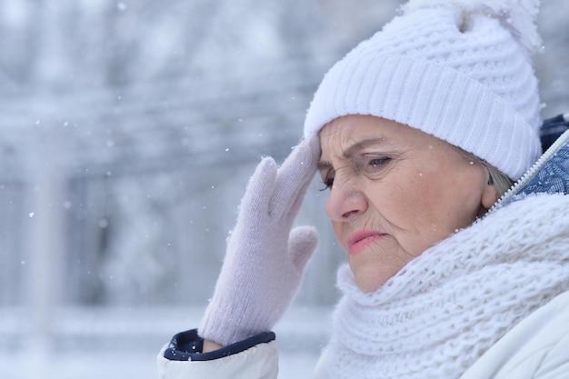 Senior woman in frosty winter