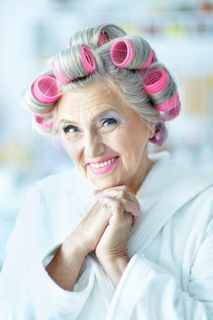 Senior woman in  hair rollers at home