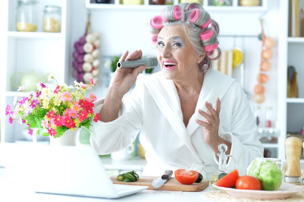 Senior woman in hair rollers