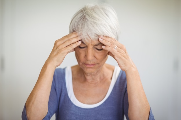senior woman having headache