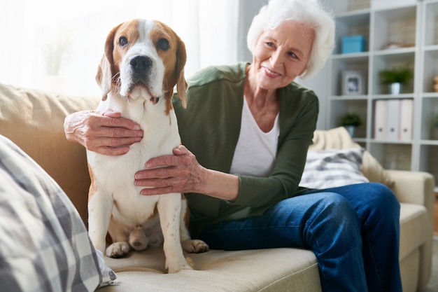 Senior woman and her dog at home