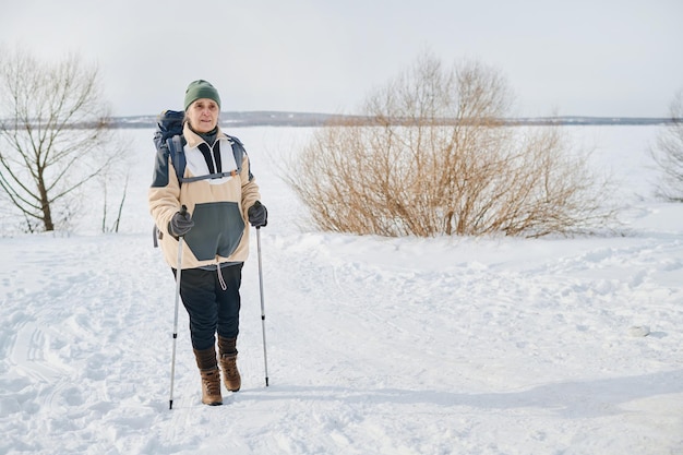 Senior woman hiking on winter day